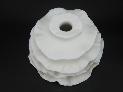Wall Installation; Porcelain, Hand Built, Unglazed, Cone 10 Oxidation; 16x16x8cm; 2011