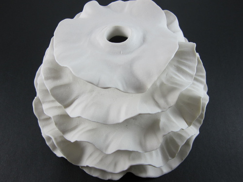 Wall Installation; Porcelain, Hand Built, Unglazed, Cone 10 Oxidation; 16x16x8cm; 2011