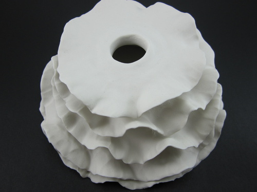 Wall Installation; Porcelain, Hand Built, Unglazed, Cone 10 Oxidation; 16x16x8cm; 2011