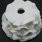 Wall Installation; Porcelain, Hand Built, Unglazed, Cone 10 Oxidation; 16x16x8cm; 2011