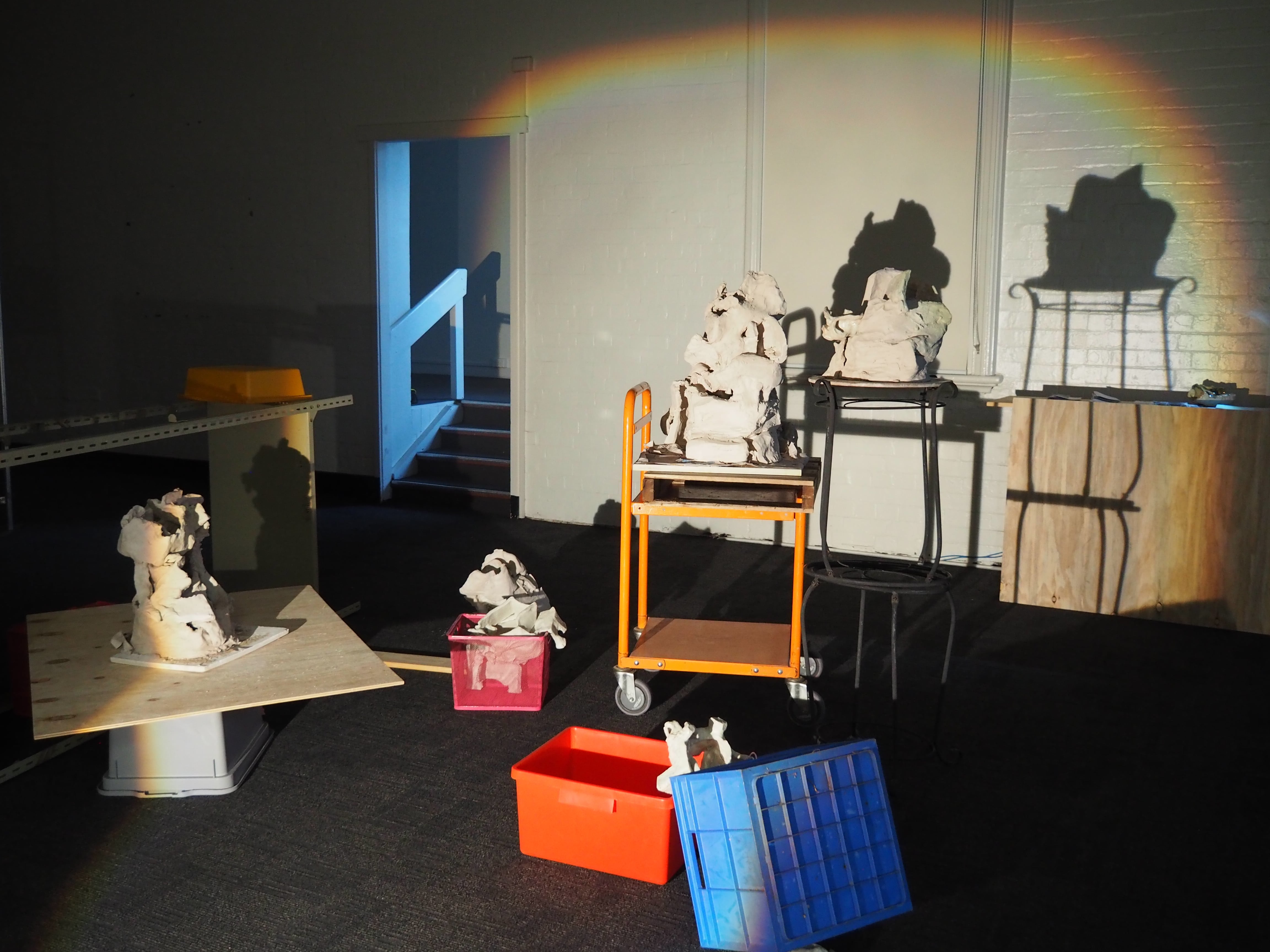Recycled clay (unfired and fired), coloured slip, glaze, ceramic studio trolley, kiln props, kiln shelf, wood, found objects (from family home), zines; printer paper, printer ink, polyester thread, movie stills