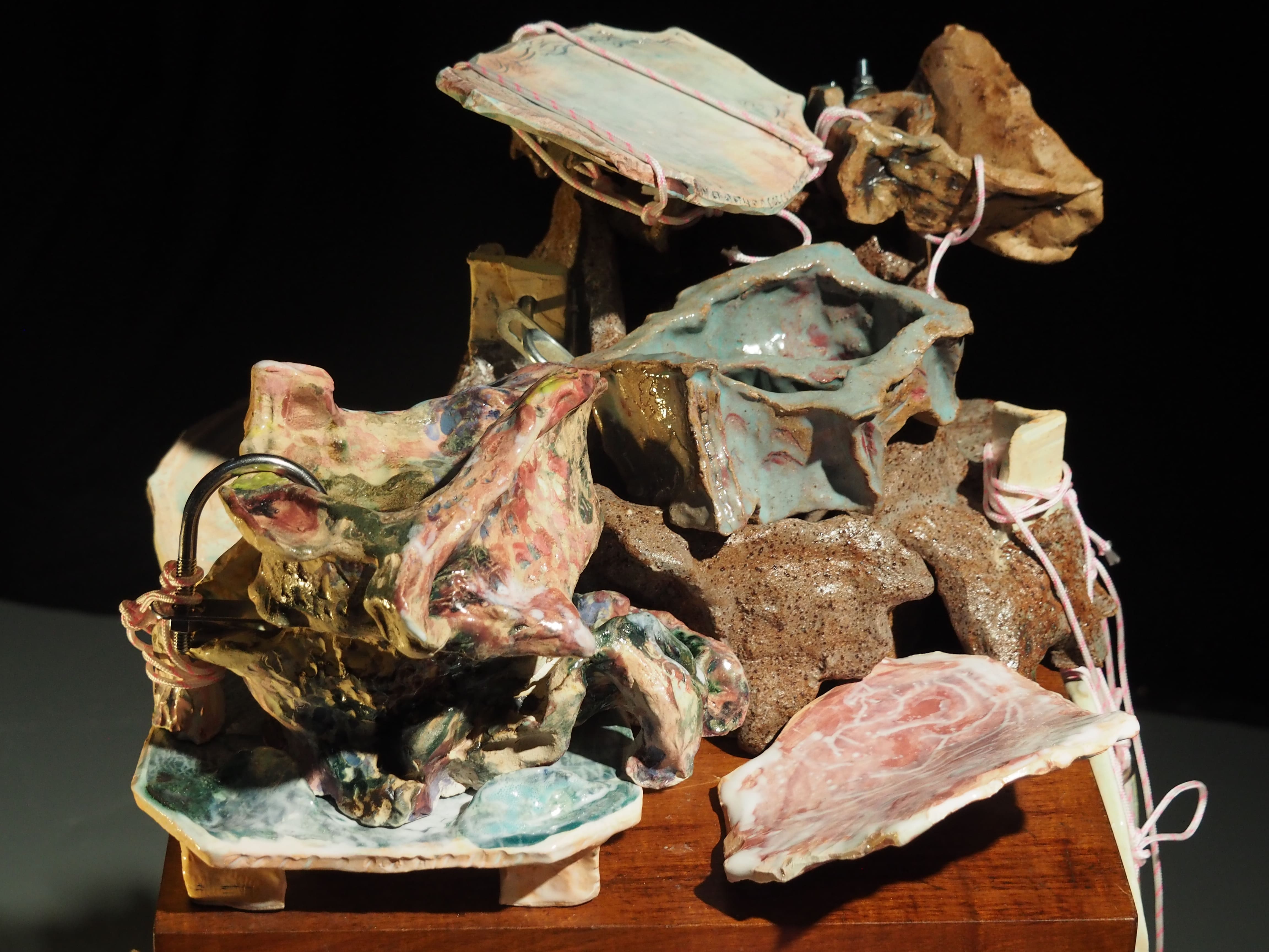 Clay, glaze, rope, metal fixtures, bedside table and found objects.