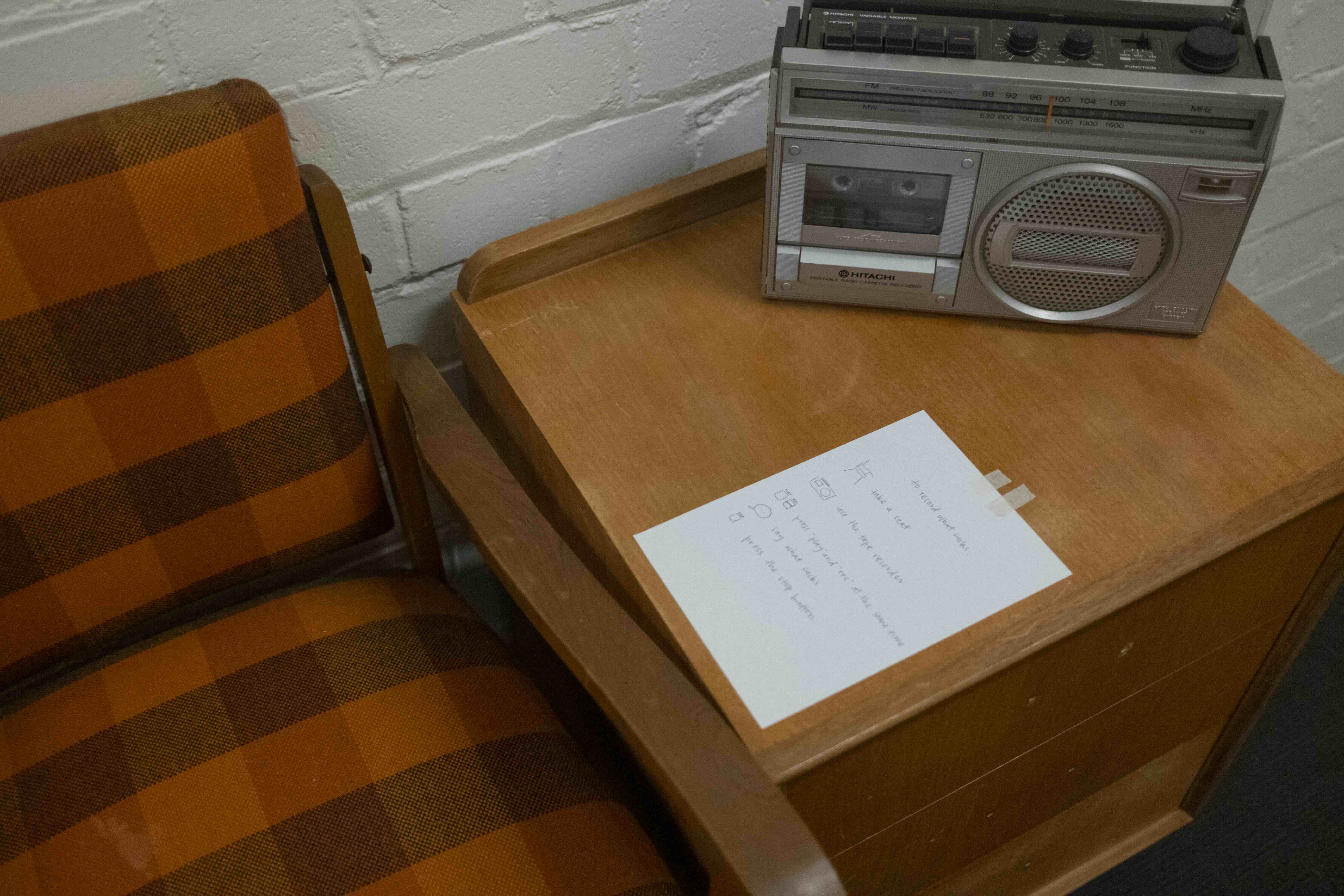Wire, paper, glue, masking tape, side table, chair, cassette player