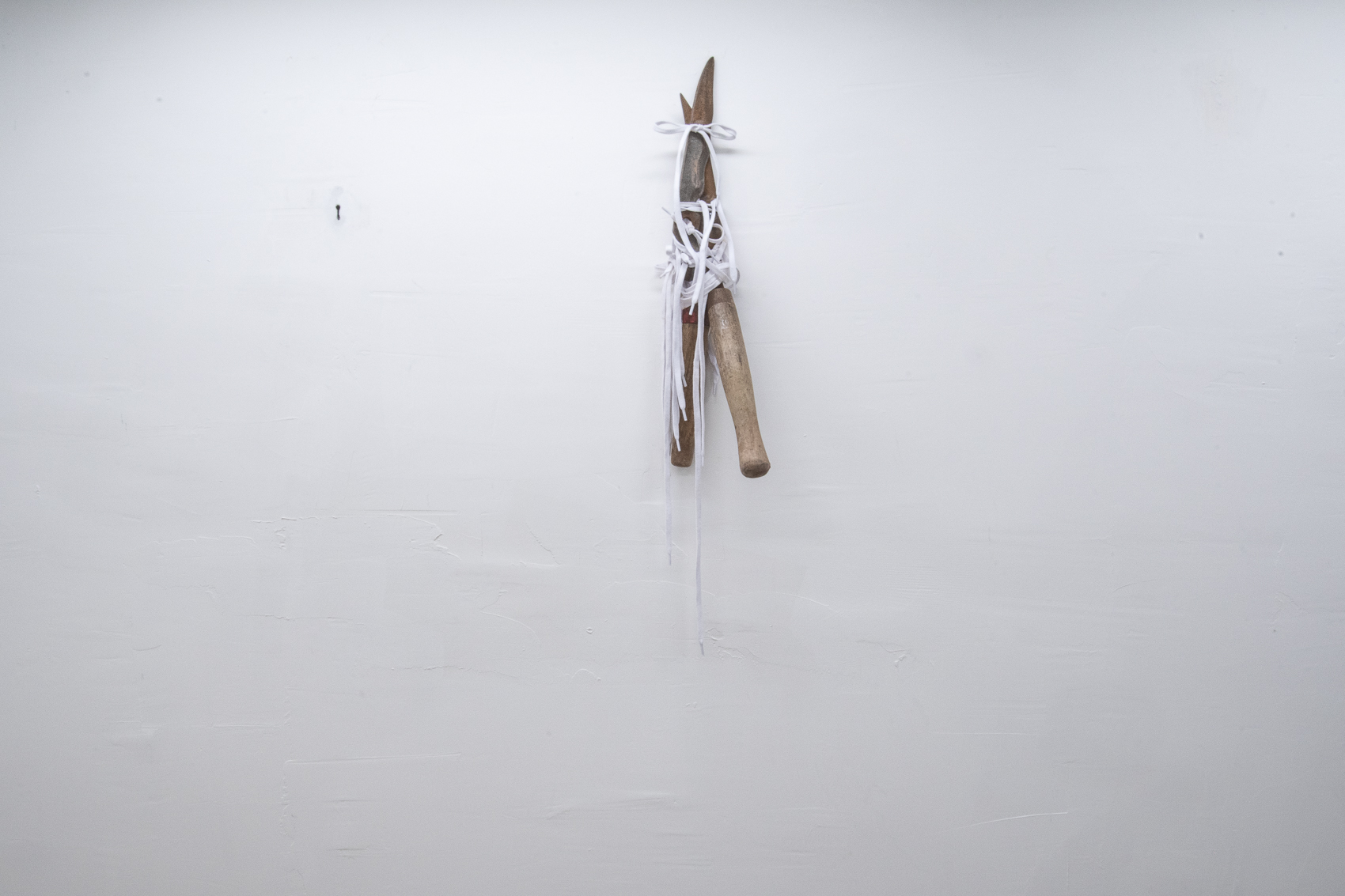 'Scission', 2024. Found garden shear blades, shoelaces