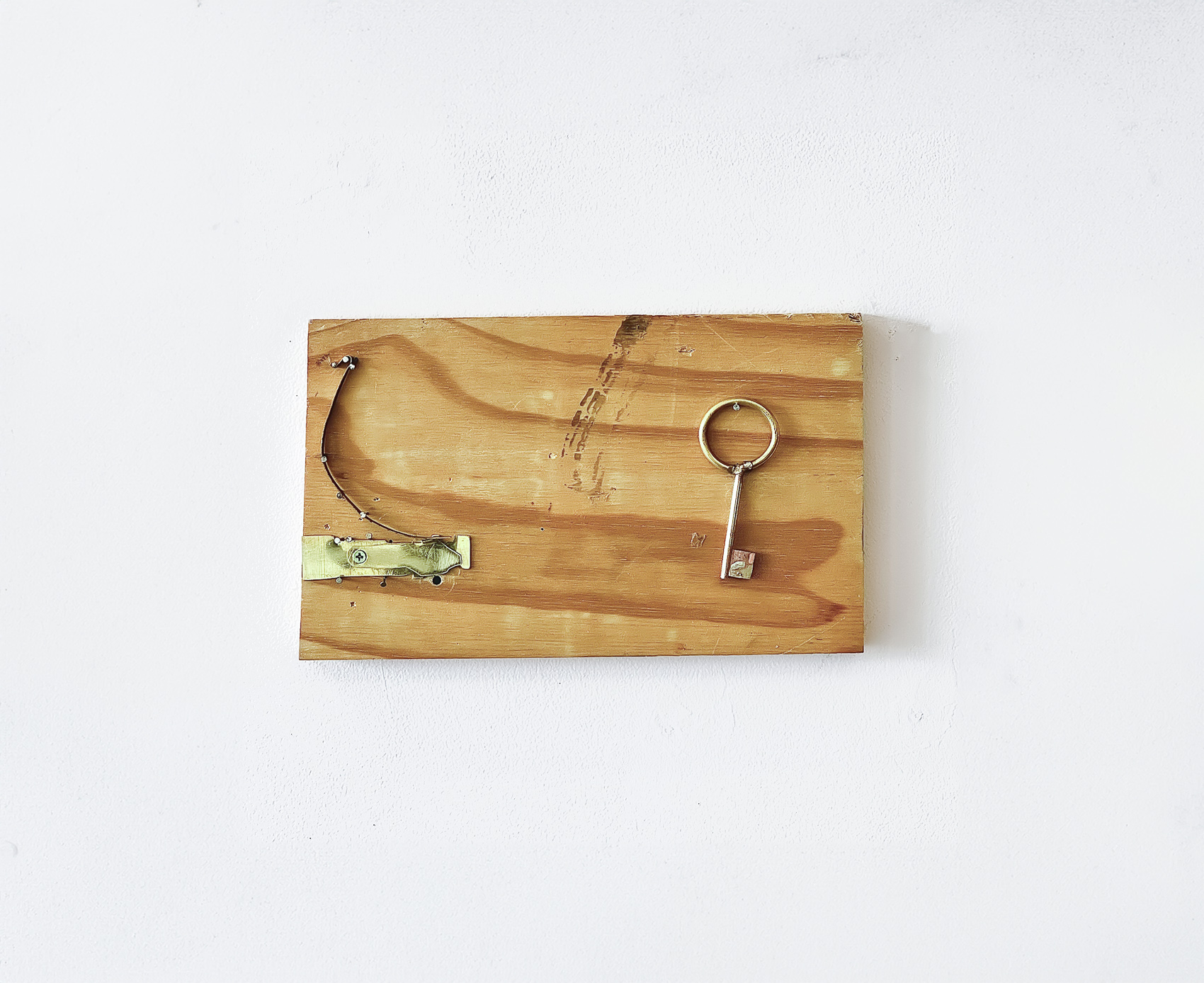 'Lock 1', 2024. Brass, steel, silver solder, saw blade, wood, tape