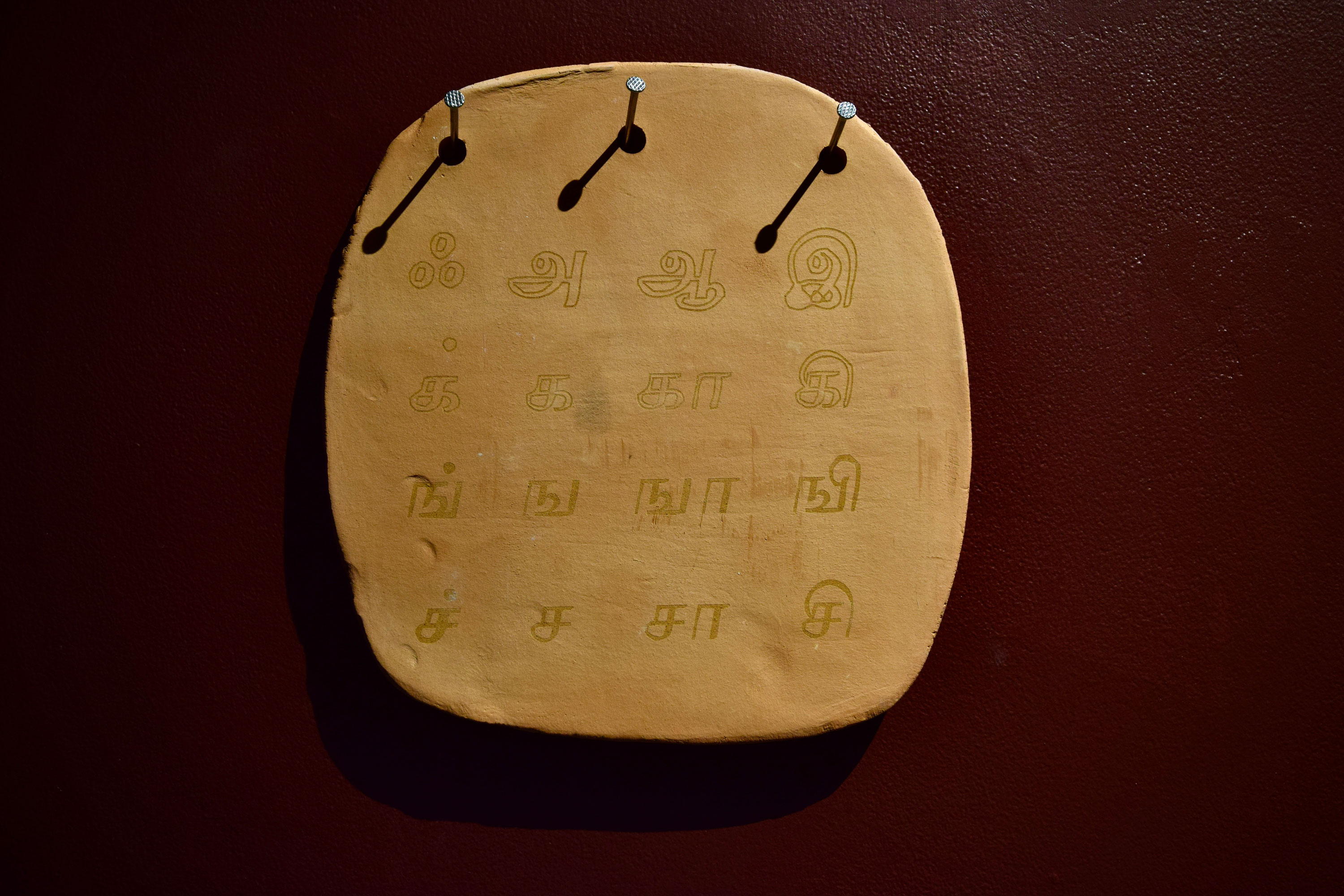 'Cu-Vun-Dar (detail)', 2024. Terracotta, cobalt glaze, cobalt carbonate, underglaze, paint, acrylic medium, gold lustre
