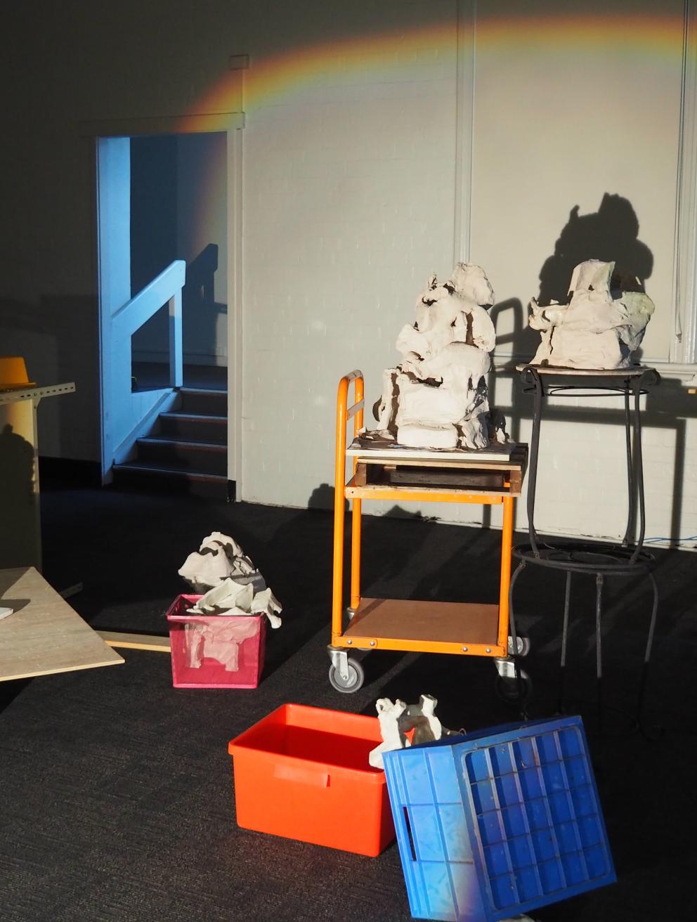 Recycled clay (unfired and fired), coloured slip, glaze, ceramic studio trolley, kiln props, kiln shelf, wood, found objects (from family home), zines; printer paper, printer ink, polyester thread, movie stills
