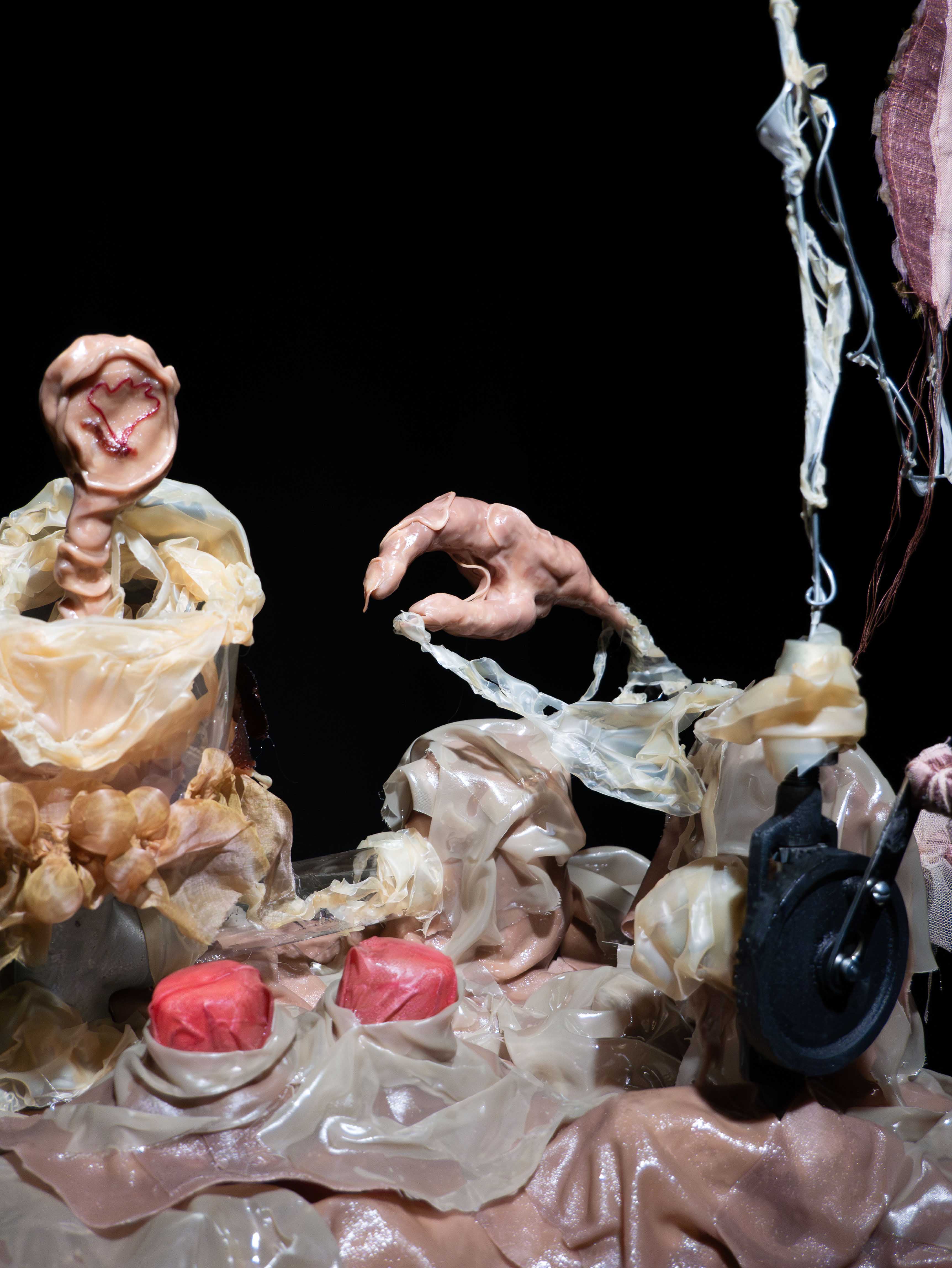 'The Fabricator', 2025. Fabric, latex, resin, crank, clay, lights