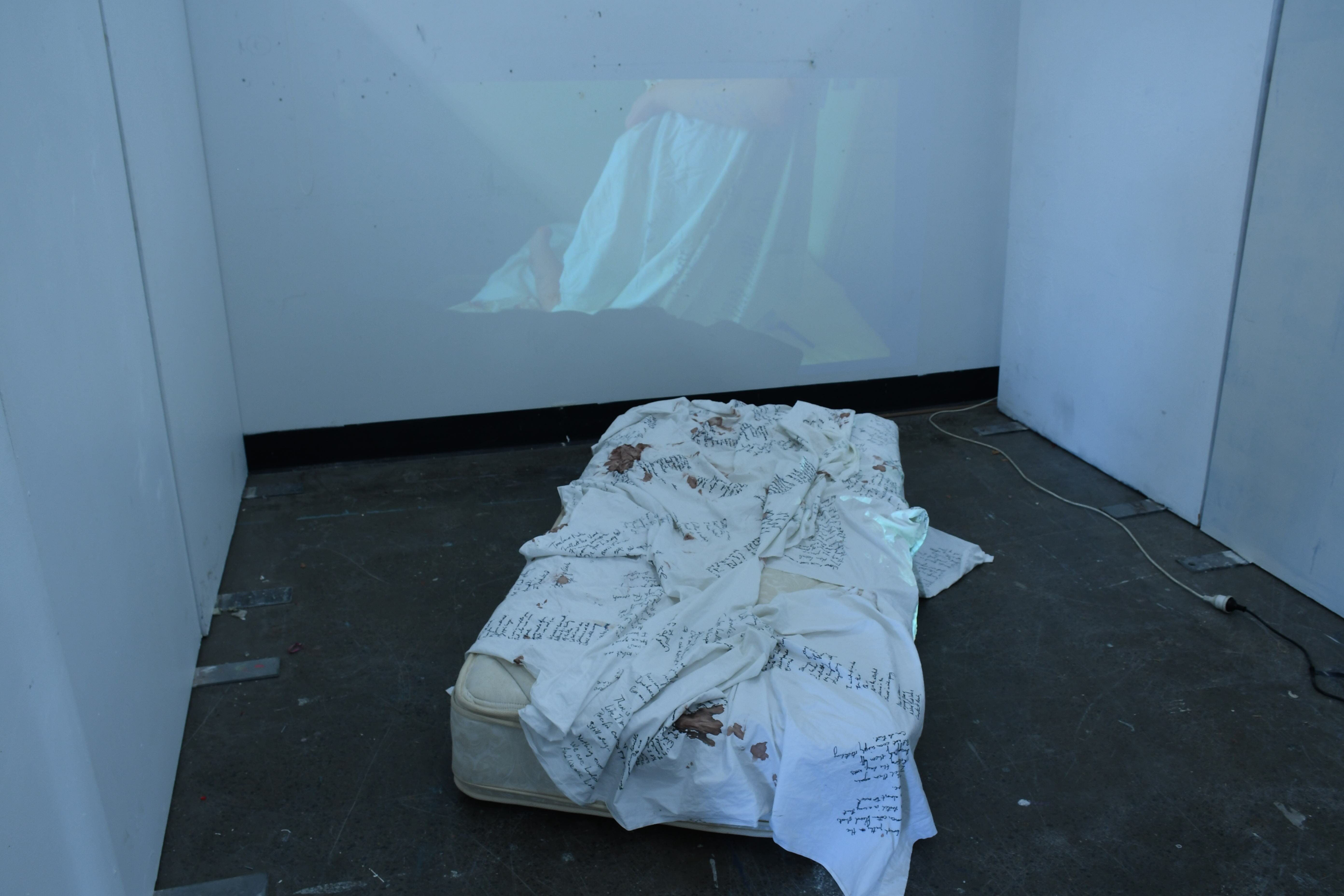 'Viscous Dreams #2', 2025. Pen on Bedsheet, mattress, video installation (48 min duration)