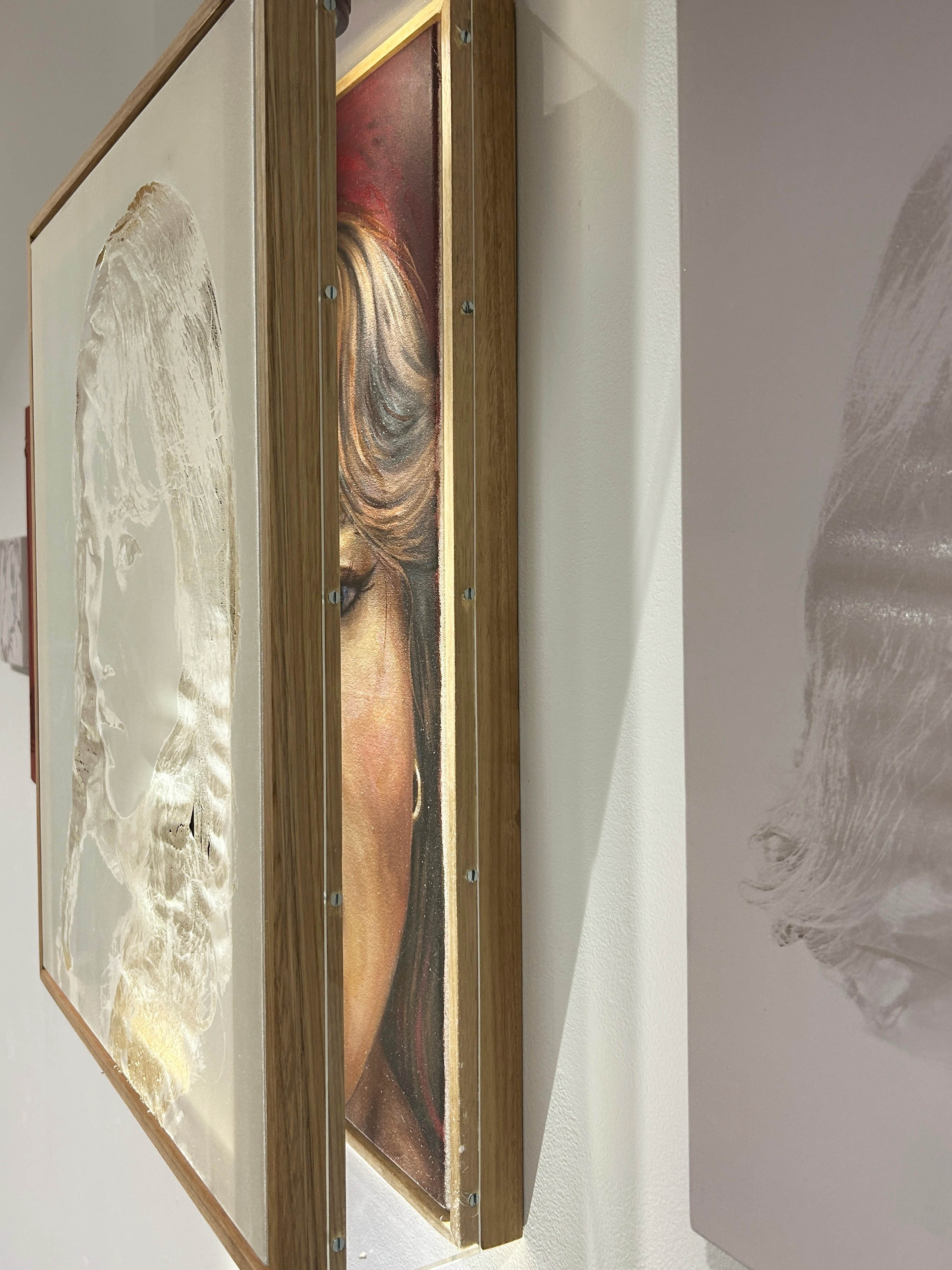 'Reality Check', 2025. Oil paint on canvas, laser etchings on synthetic fabric, wooden and acrylic custom frame