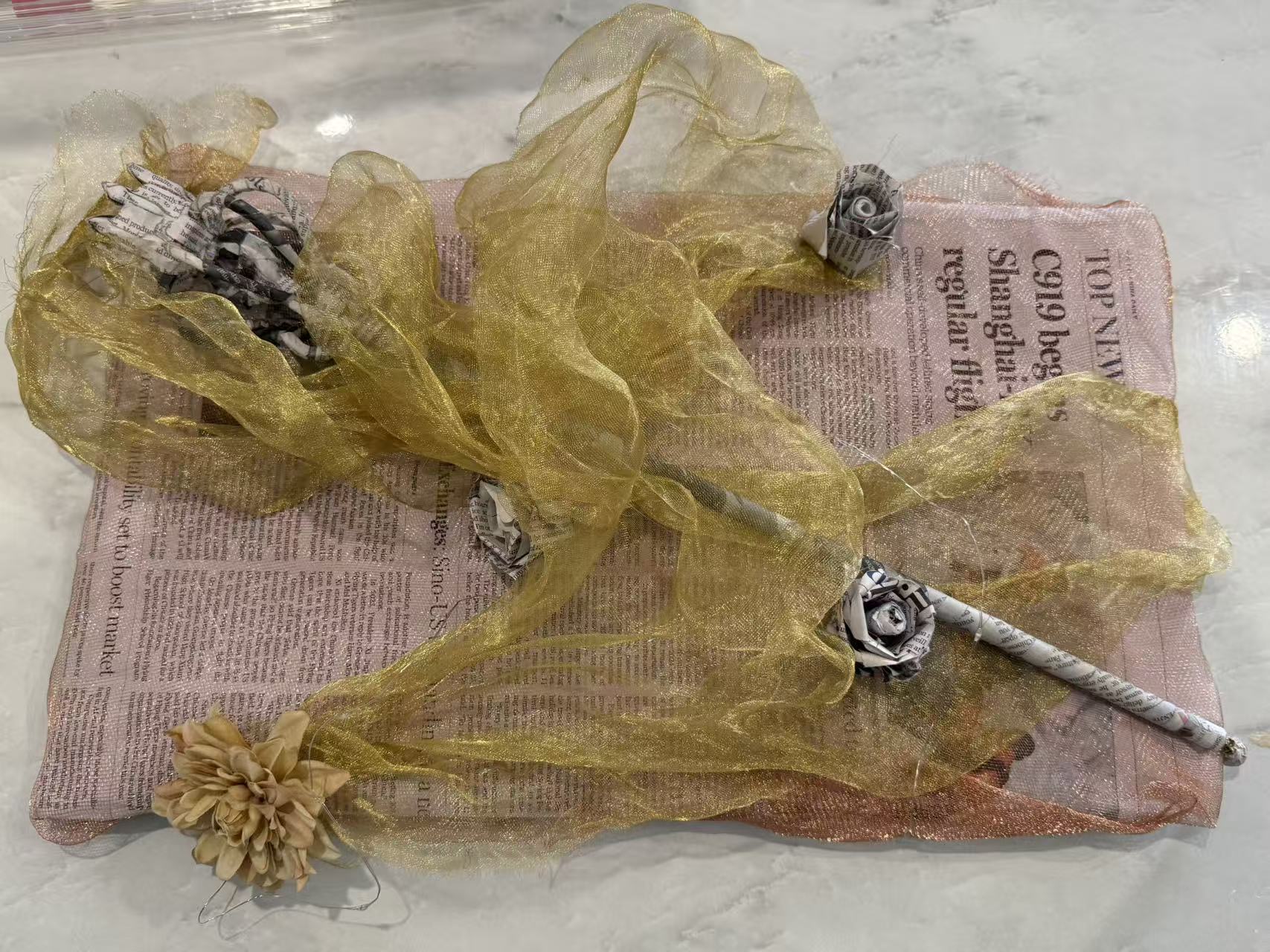'Echoed Voice', 2025. Metal, newspaper, metal mesh, cardboard
