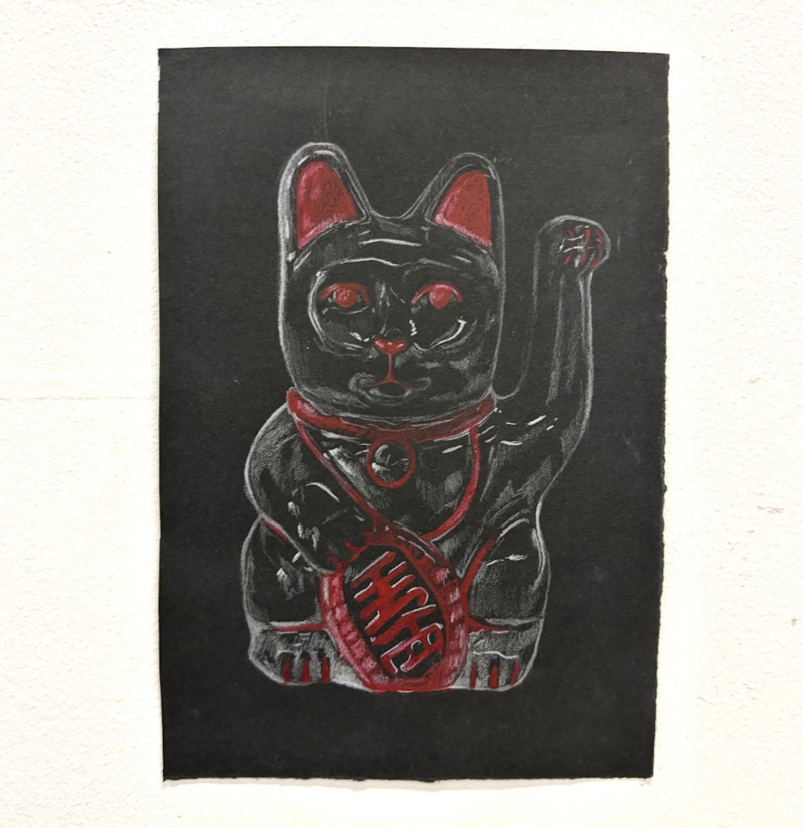 'Turning the maneki-neko into a feared presence (drawing study)', 2025. Pencil on black paper