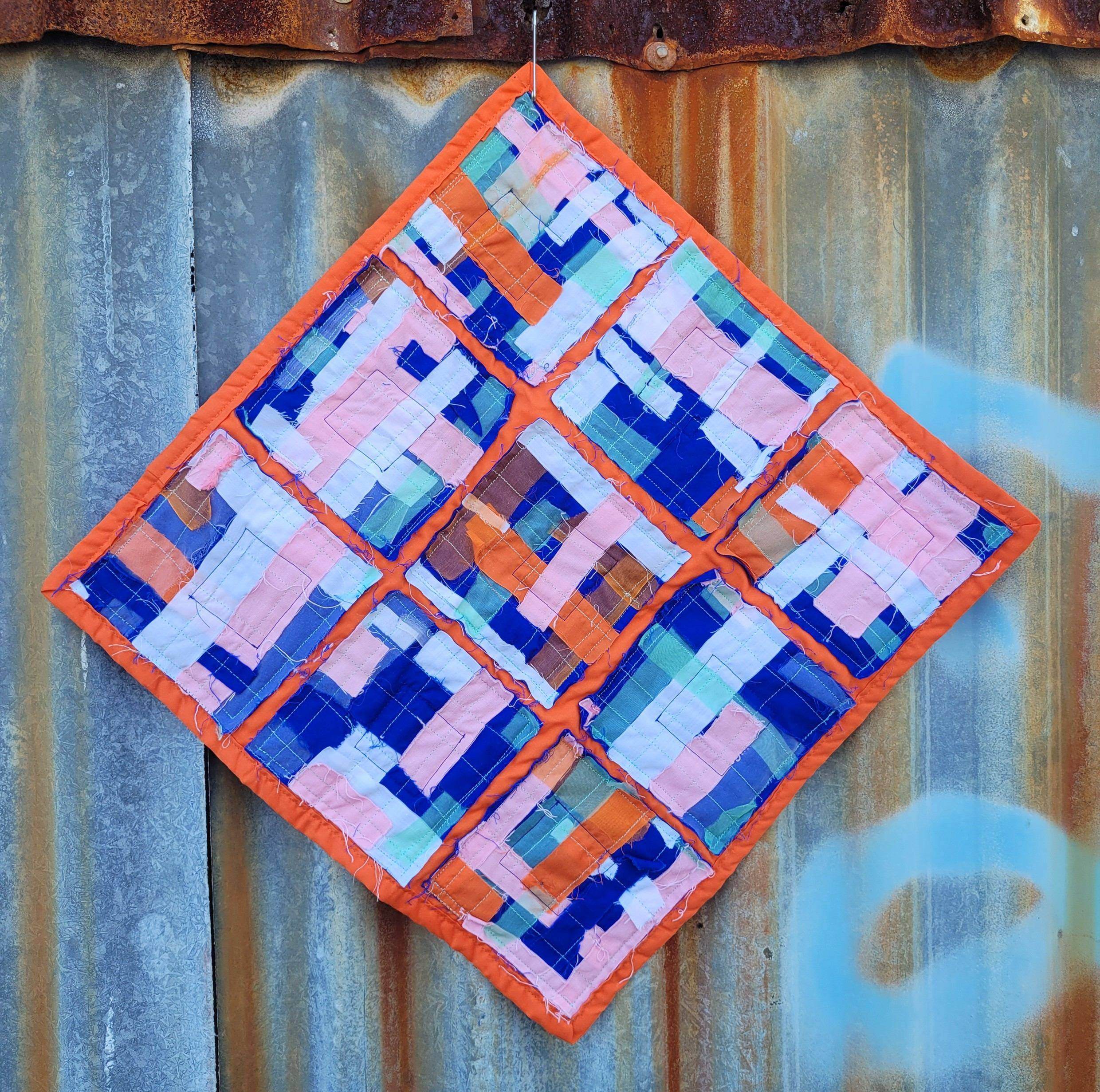 'Urban Rust: Human Construction', 2024. Cotton and silk quilt 