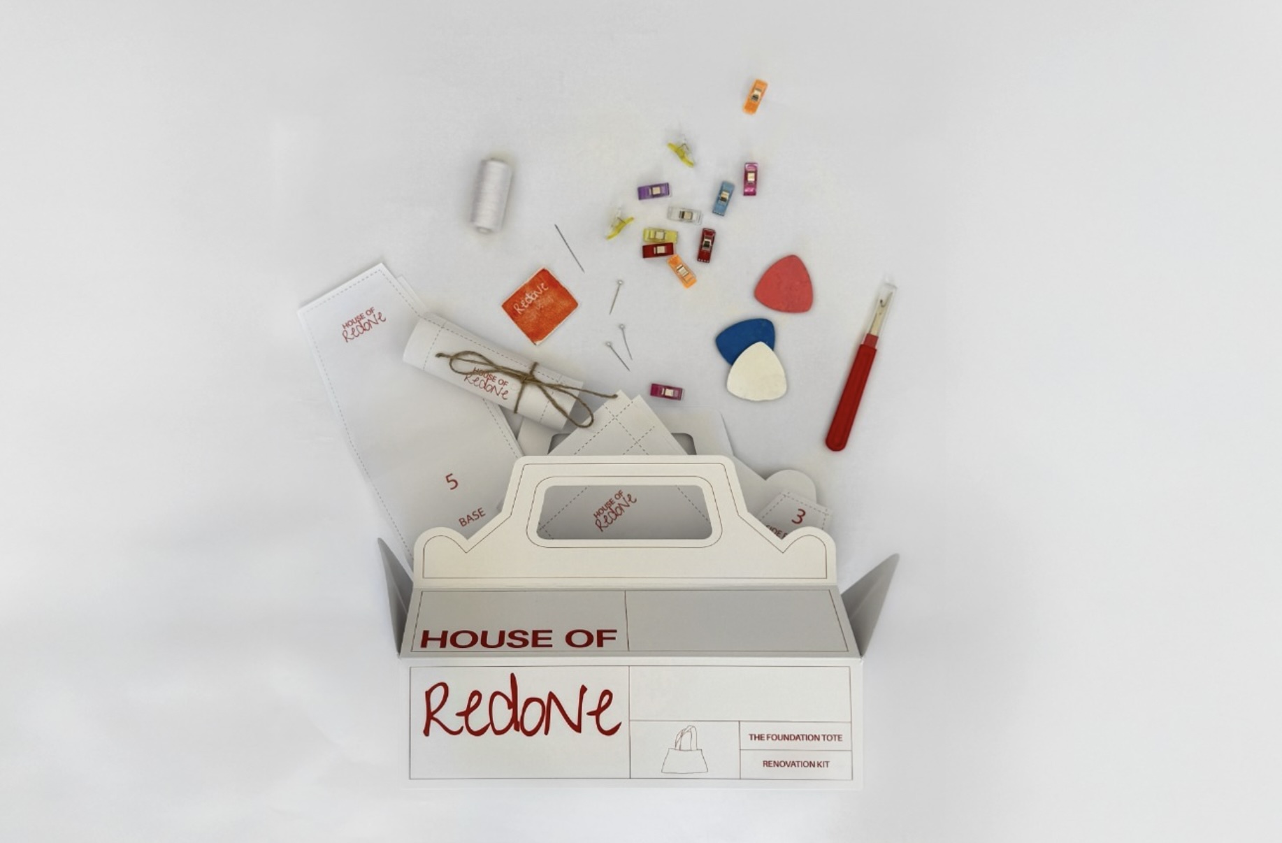 'House of Redone, a series of Textiles DIY Renovation Kits', 2025. Fabric chalk, needle, pattern pieces, pins, recyclable paper (packaging), redone label, seam ripper, sewing clips, thread