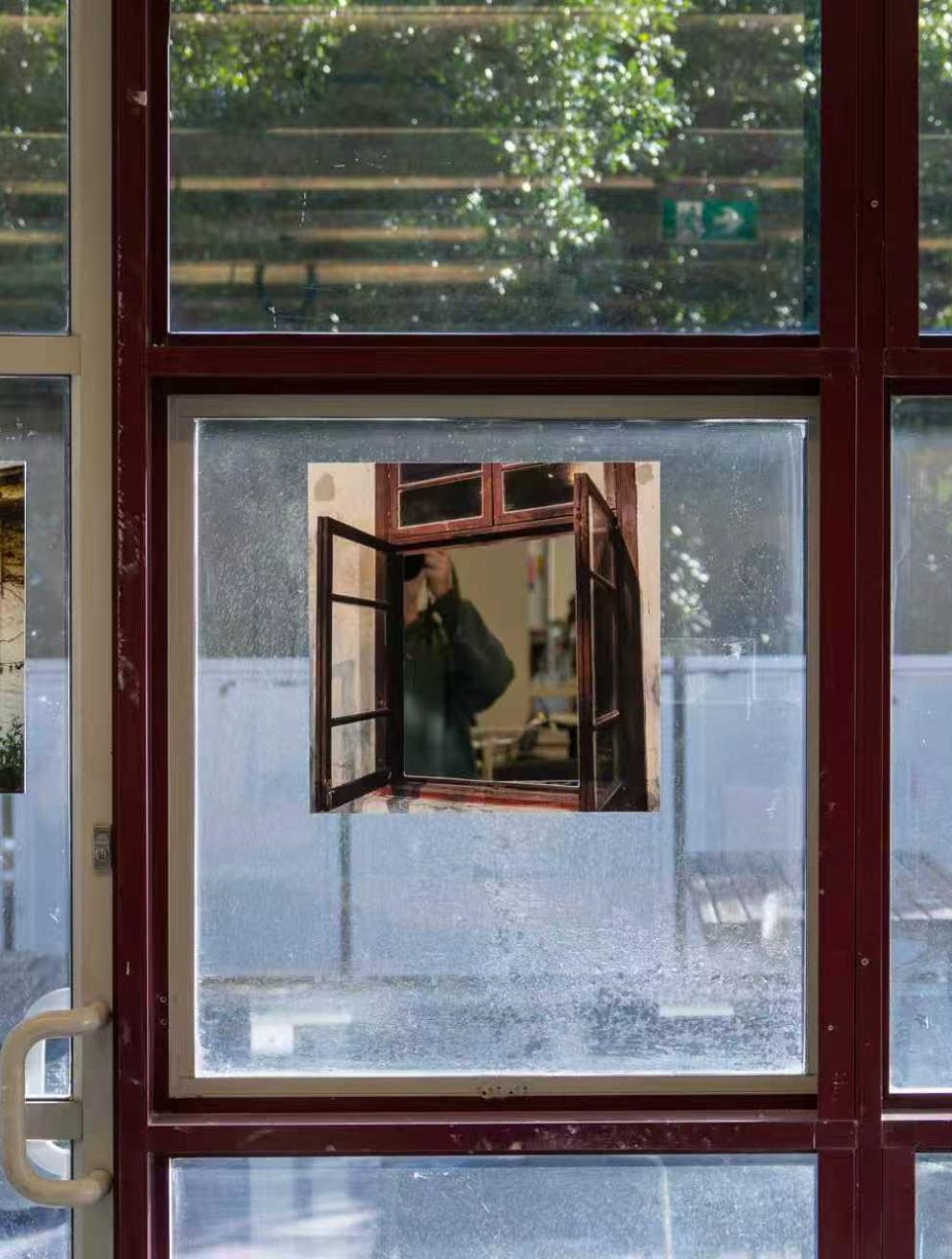 'The Void Windows', 2025. Long-exposure photographs with cut-out window areas, mirror, textured acrylic, tracing paper, yellow paper