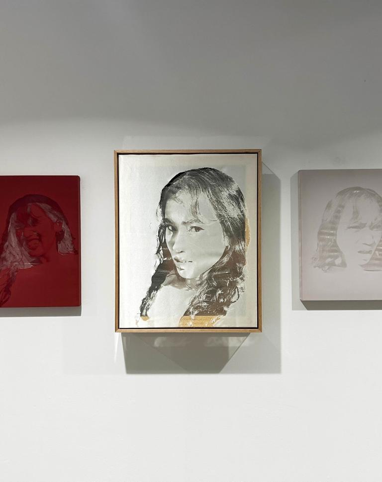 'Reality Check', 2025. Oil paint on canvas, laser etchings on synthetic fabric, wooden and acrylic custom frame