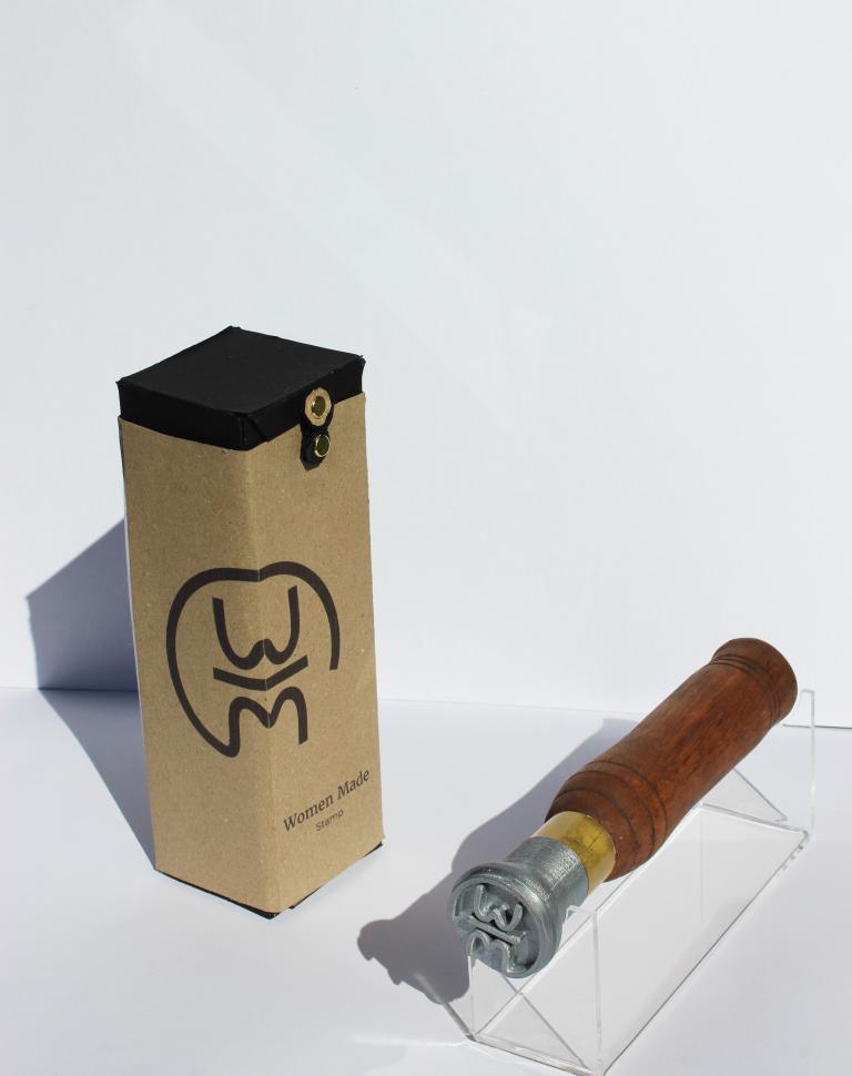 'Women Made', 2025. Glacial oak, PLA, brass, acrylic stand, Enviroboard packaging